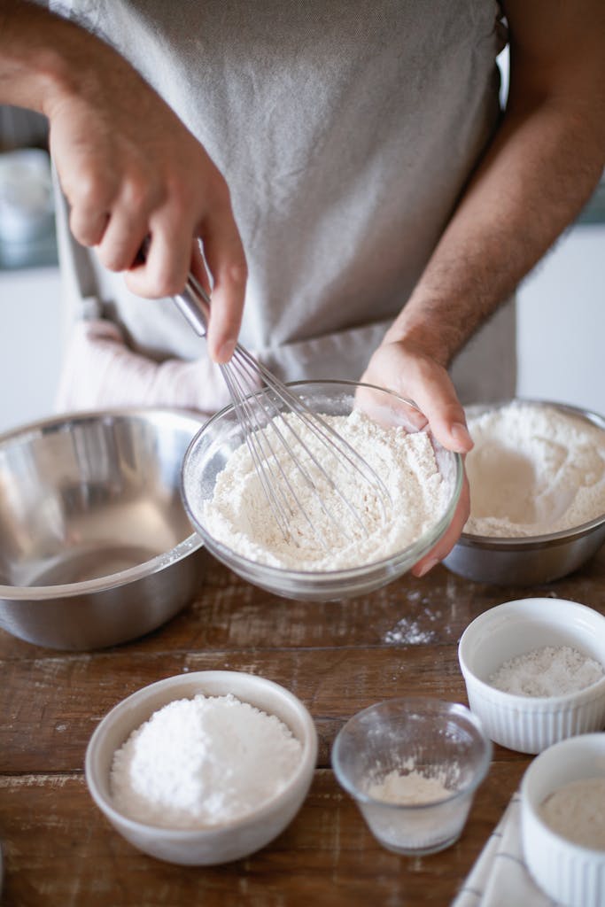 Person Holding a Bowl of Flour