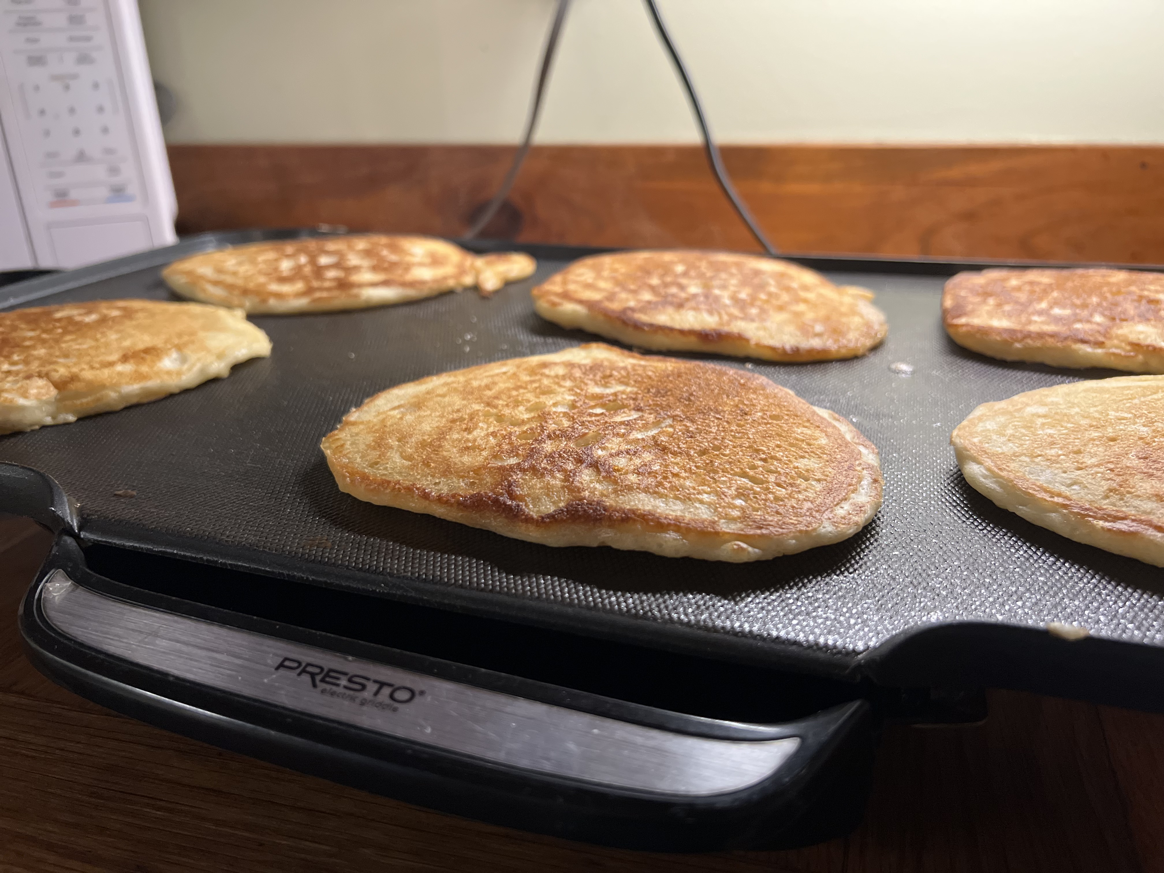 sourdough pancakes on a griddle