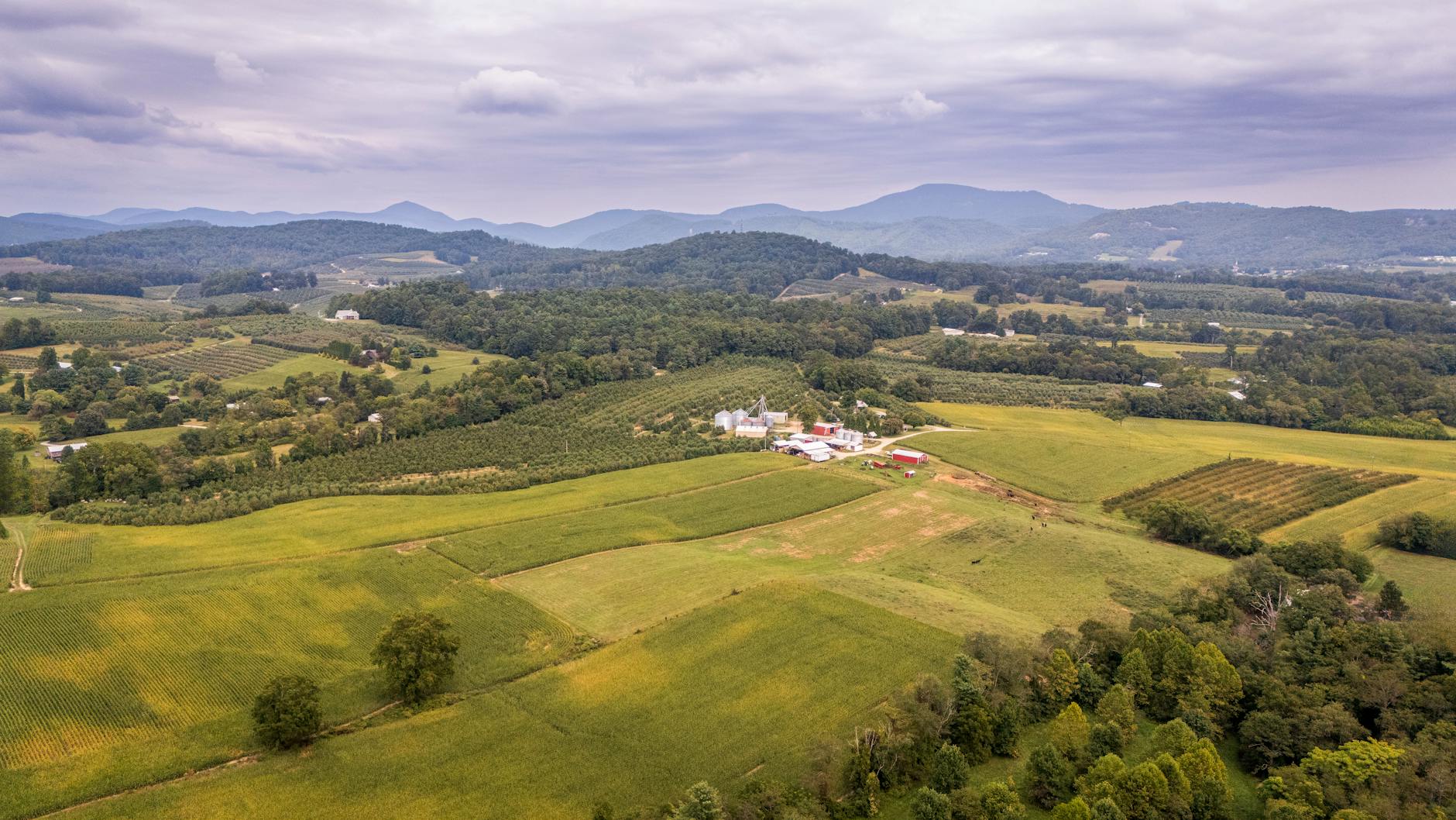 an aerial view of a farm and rolling hills north Carolina Best states for homesteading